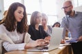 Lecturer and multinational group of students in an auditorium Royalty Free Stock Photo