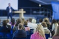 Lecturer Speaking In front of the Large Group of People