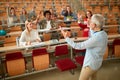 Lecturer in university - students listening to teacher in the classroom on college