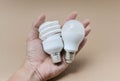 LED bulb and Fluorescent bulb on hand Royalty Free Stock Photo