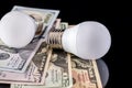 Led bulb with usa money isolated Royalty Free Stock Photo