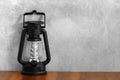 LED camping lantern flashlight on wooden table Royalty Free Stock Photo