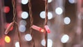 LED Christmas garlands blinking on the background of bokeh blurred lights. Concept. Close up of flashing lights of light Royalty Free Stock Photo