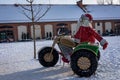 LED Christmas illumination of Santa Claus riding a vintage motorcycle with a sidecar. Royalty Free Stock Photo