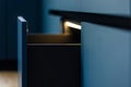 LED drawer. Blue fronts. Minimal kitchen Royalty Free Stock Photo
