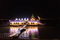 LED electric lighted riverboat in Harbin China against twilight sky