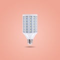 LED energy saving lamp 230v on orange pastel color background Royalty Free Stock Photo