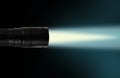LED flashlight beam on black background