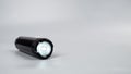 led flashlight on gray background with copy space Royalty Free Stock Photo