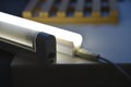 LED lamp on the desk. Glowing fluorescent lamp and LED on a black table