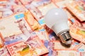 LED lamp on large tenge banknotes Royalty Free Stock Photo