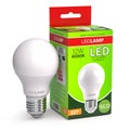 Led lamp with package box isolated on white. Energy efficient light bulb Royalty Free Stock Photo