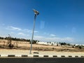 LED lamppost with solar battery on the side of the road in the desert under the open sky, tropical, southern, warm resort under th