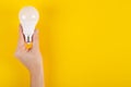 LED light bulb composition on yellow background