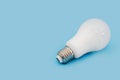 LED light bulb E27 on blue background.Copy of space. Royalty Free Stock Photo