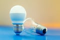 Led light bulb lay next to incandescent bulb Royalty Free Stock Photo