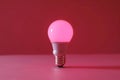 Led light bulb on pink background, minimal concept studio photography Royalty Free Stock Photo