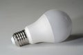 Led light bulb on a white canvass surface Royalty Free Stock Photo