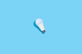 LED light bulbs on blue color background. Flat lay with copy space. Concept ecology, save planet earth, idea Royalty Free Stock Photo