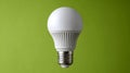 LED lightbulb on a green background, eco-friendly technology Royalty Free Stock Photo
