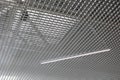 LED lighting lamp on the ceiling of an commercial building. Grid structure of suspended ceiling in an mall building