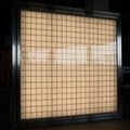 LED panel featuring a grid of uniformly lit squares with a warm Royalty Free Stock Photo