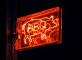 LED signage of a pig with the word BBQ in Tulum, Quintana Roo, Mexico during nighttime