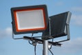 LED spotlight against the blue sky. Lighting area. The use of technology in modern construction Royalty Free Stock Photo