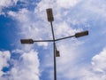 Led street light close up shot, blue sky with white clouds