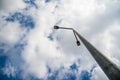 Led street light on concrete pylon, blue sky with white clouds in the background. Royalty Free Stock Photo