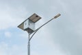 LED street light with solar cell panel on blue sky Royalty Free Stock Photo