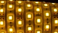 LED strip lights, shining yellow diodes tape.
