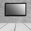 LED television screen mockup, blank hdtv on concrete wall in the room Royalty Free Stock Photo