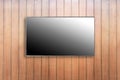 LED tv television screen mockup / mock up, blank on wooden wall background Royalty Free Stock Photo