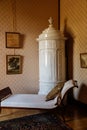 Lednice, Southern Moravia, Czech Republic, 04 July 2021: Castle interior with baroque wooden carved furniture, bedroom with chaise