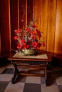 Lednice, Southern Moravia, Czech Republic, 04 July 2021: Castle interior with metal vase with a bouquet of poppies and dried