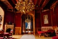 Lednice, Southern Moravia, Czech Republic, 04 July 2021: Castle interior with neo-gothic wooden carved ceiling and furniture, red