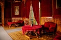 Lednice, Southern Moravia, Czech Republic, 04 July 2021: Castle interior with neo-gothic wooden carved ceiling and furniture, red