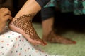 Ledy Feet and Hands in Heena for wedding in Orange and red background and isolated hand and feet Royalty Free Stock Photo