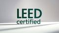 LEED certified logo displayed on a clean surface with soft shadows in a neutral space Royalty Free Stock Photo