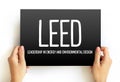LEED - Leadership in Energy and Environmental Design acronym text on card, abbreviation concept background