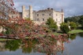 Leeds Castle in Kent UK, reflected in the surrounding moat, photographed on a crisp, clear morning in autumn. Royalty Free Stock Photo