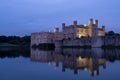 Leeds Castle near Maidstone in Kent UK. Castle is reflected in the surrounding lake. Photographed in late afternoon.