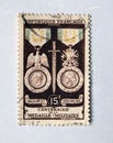 An old purple french postage stamp celebrating the centenary of the military medal in 1956 Royalty Free Stock Photo