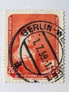 An old red east german postage stamp with an image of the artist Jean-Ãâ°tienne Liotard