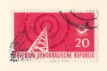 An old red east german stamp with an image of a radio transmitter