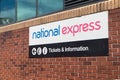 National Express coach travel service sign with logo and branding on wall giving Royalty Free Stock Photo