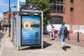 O2 mobile phone poster advert on the side of a bus stop