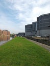 the leeds lock entrance to clarence dock with footbridge over the river aire and lock gates and mooring area surrounded by modern Royalty Free Stock Photo