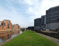 the leeds lock entrance to clarence dock with footbridge over the river aire and historic gates and mooring area surrounded by Royalty Free Stock Photo